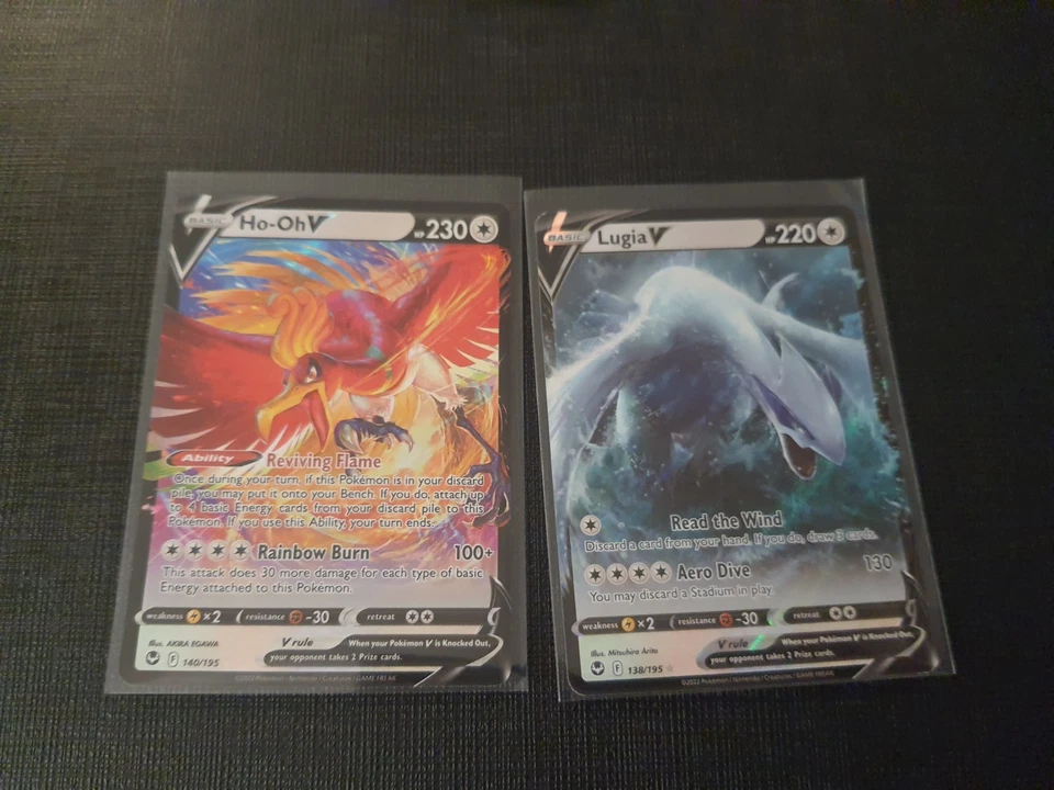 Juego de cartas coleccionables Pokémon Lugia V 138/195 y Ho-Oh V 140/195 Silver Tempest ligeramente jugado Foto 1 de 1