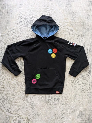 Sudadera con Capucha Nintendo Live 2023 Seattle Negra Con Parches Coloridos Adultos Pequeños Juegos Foto 1 de 4