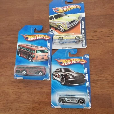 3 Hot Wheels "HW City Works" Dodge Charger SRT8, 66GTO Wagon, Surfin School Bus - Image 1 of 4