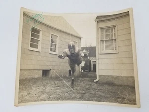 1953 Photograph Man in Football Uniform Helmet Falling Stumbling Running - Picture 1 of 4