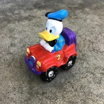 DISNEY ENESCO CERAMIC DONALD DUCK FIGURINE IN CAR Racing - Image 1 of 4