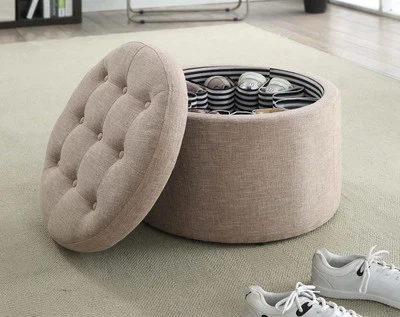 Elegante otomana redonda de tela tostada con almacenamiento de zapatos y tapa extraíble  Foto 1 de 4