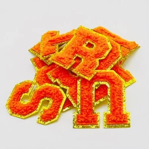 “N” Neon Orange Iron On 2” Chenille Letter Patch With Gold Glitter Trim - Picture 1 of 8