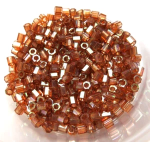 8/0 DELICA ~ ROOT BEER GOLD LUST ~ DBLC0122 HEX CUT ~ 10 Grams ~ SEED BEADS - Picture 1 of 1