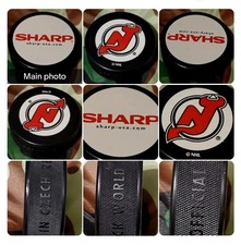 SHARP - USA 🇺🇸 SPONSOR NEW JERSEY DEVILS RARE NHL PUCK WORLD MADE IN 🇨🇿