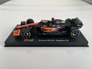 Bburago 1:43 Formula1 McLaren Racing MCL36 2022 Daniel Ricciardo #3 Singapore GP - Imagen 1 de 24