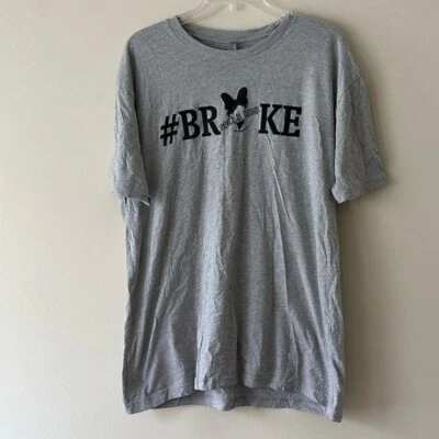 Camiseta Universal Studio Next Level Apparel Manga Corta Estampado Gráfico Roto Informal Foto 1 de 4