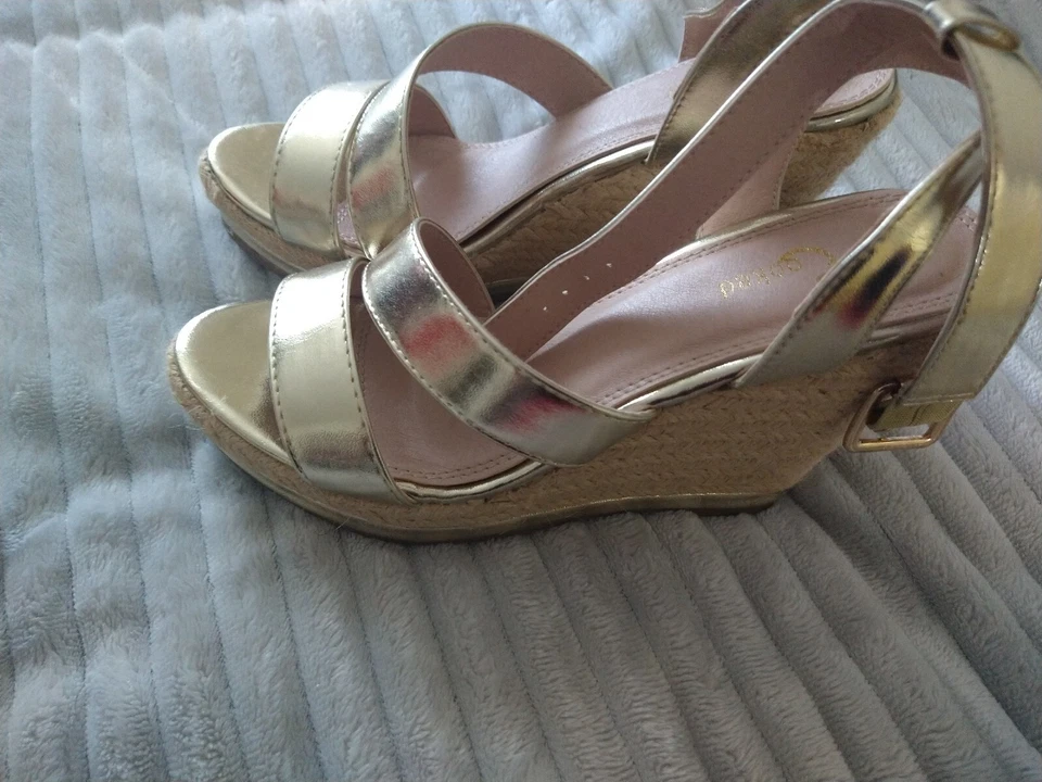 Two Pairs of Size 7 women silver and gold crossed strapped platform heels - Image 1 of 4