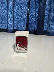 OEM  GM  SATURN SL SL1 SL2 FRONT BUMPER EMBLEM 1991-2002 # 21111139 - Picture 1 of 3