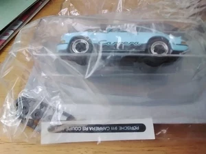 COLLECTABLE DEAGOSTINI PORSCHE 911 CARRERA COUPE 1973 IN BLUE MINT IN BOX - Picture 1 of 2