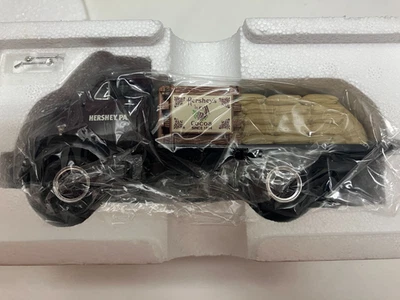 First Gear 1952 GMC plataforma plana con sacos de arpillera Hersheys 1/34 Foto 1 de 3