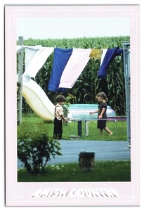 Amish Country Young Children Playing Under Family Laundry Clothes Line Postcard - Picture 1 of 2
