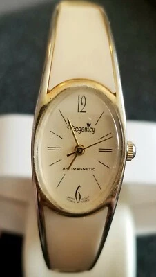 Reloj Pulsera De Colección Regenicy Mecánico Escritura Tono Oro Crema Retro NO FUNCIONA Foto 1 de 4