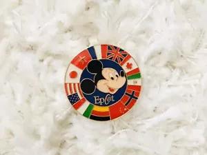 Vintage Walt Disney World Epcot Mickey Mouse Circle Pin of Country Flags (#521) - Imagen 1 de 3