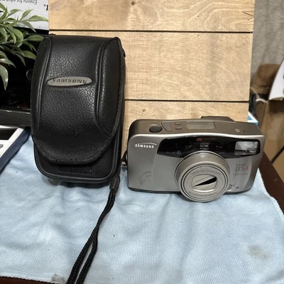 Cámara fotográfica compacta Samsumg AF delgada 115A zoom 35 mm - Panorama y macro con estuche Foto 1 de 4