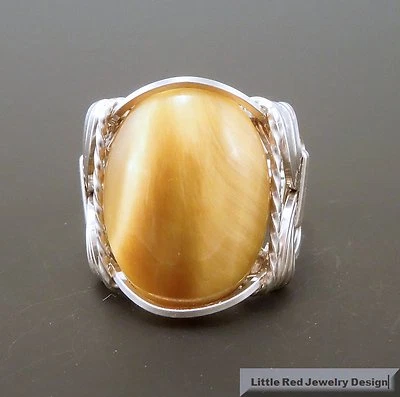 Anillo envuelto en alambre de cabujón ojo de tigre miel de plata de ley  Foto 1 de 4