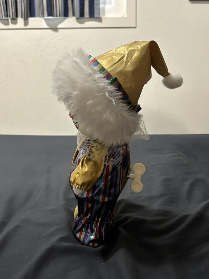 Boneca palhaço vintage musical ouro com listras com cabeça em movimento - Imagem 1 de 4