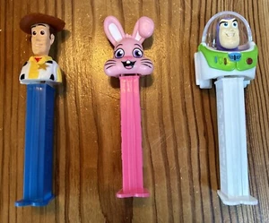 Pixar Toy Story Pez Dispensers - Woody & Buzz Lightyear & Pink Floppy Ear Bunny - Picture 1 of 4