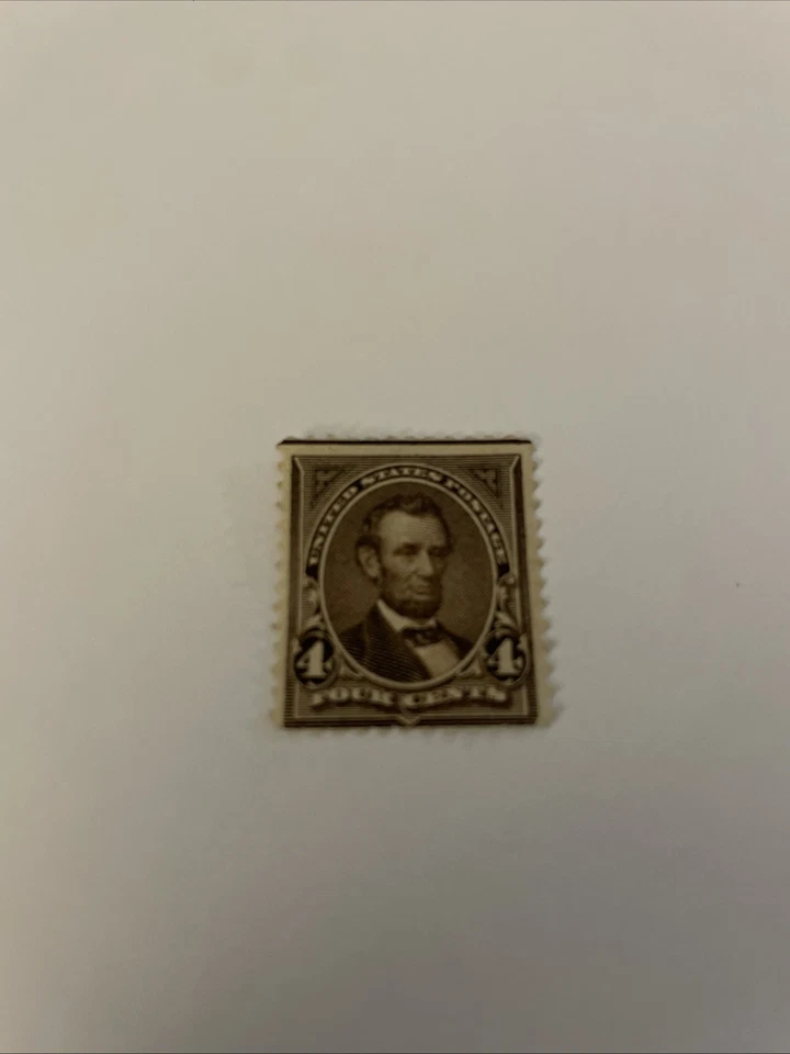 Estampilla postal rara de 4 centavos de Abraham Lincoln marrón oscuro Foto 1 de 2