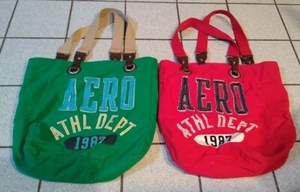 Bolsos de mano Aeropostale 1987, lote de 2, lona de hombro roja + verde con asas - Imagen 1 de 3