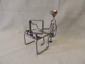 Metallic construction hand made man on his computer - Picture 1 of 8