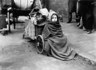 Queues people barrows, prams, push chairs & other containers besie - 1947 Photo