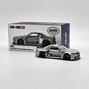 MINI GT KAIDO HOUSE NISSAN SKYLINE GT-R R34 WORKS SHINJUKU V1 CHASE CAR KHMG143 - Picture 1 of 1