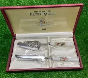 Cuchillo para servidor de pasteles y pasteles Peter Rabbit cubiertos color plata usado - Imagen 1 de 10