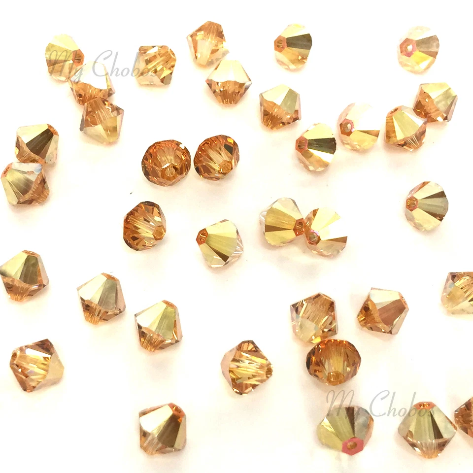 3mm CRYSTAL METALLIC SUNSHINE gold Swarovski crystal 5328 Loose Bicone Beads - Image 1 of 1