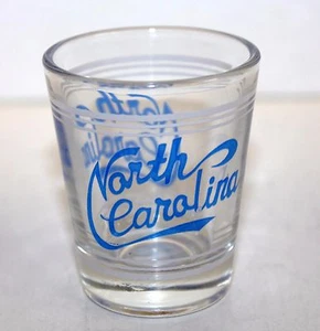 CRISTAL TIRO CAROLINA DEL NORTE (letras azules, rayas blancas alrededor de la parte superior e inferior) - Imagen 1 de 2