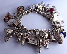 Vintage heavy solid silver charm bracelet & 34 silver charms inc opening,moving