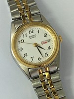 Montre ladies, SEIKO classique, quartz, 7N783-0011 A4. 2 tons or, argent.