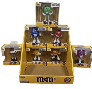 Figura Diecast M&M Figuras de Metal Jada JUEGO COMPLETO DE 7 con Caja de Exhibición TOTALMENTE NUEVA - Imagen 1 de 7