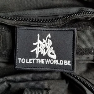 METAL GEAR SNAKE GITD TO LET THE WORLD BE SWAT HOOK PATCH DARK GRAY BADGE - Picture 1 of 3