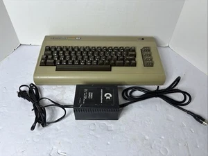 Vintage Commodore 64 Computer W/ Power cable - Powers On - For Parts - Photo 1/10