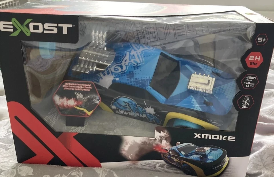 Exost Xmoke 2Ghz ferngesteuertes RC Auto mit LED-Leuchten & echtem Raucheffekt. Blau - Bild 1 von 1