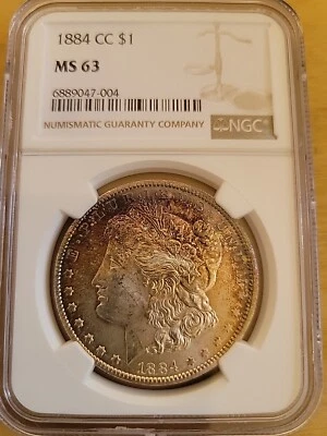 Dólar de plata Morgan 1884 CC NGC MS63 $1 como nuevo en Estados Unidos 1884-CC MS-63 anverso arco iris Foto 1 de 3