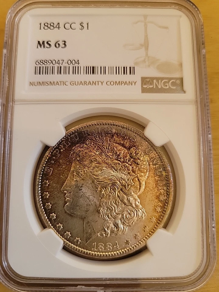 Dólar de plata Morgan 1884 CC NGC MS63 $1 como nuevo en Estados Unidos 1884-CC MS-63 anverso arco iris Foto 1 de 3