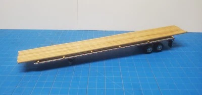 DCP Flatbed Trailer with Utility Pole Load - Image 1 of 3