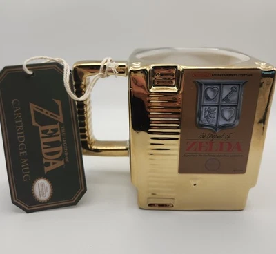 Nuevo The Legend of Zelda NES Juego Dorado Cartucho Taza Nintendo 4.5" Alto Foto 1 de 4