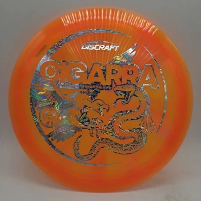 Discraft Z Swirl Cigarra Barela x Turner Colaboración Naranja/Logo Plateado 173-174g  Foto 1 de 3