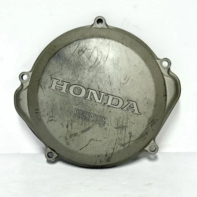 CRF250R 2004-08 CUBIERTA DE EMBRAGUE CARCASA EXTERIOR ORIGINAL OEM HONDA 11351-KRN-670 Foto 1 de 4