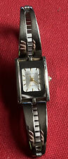 Jaclyn Smith Silver Tone Rectangle Case Bar Cut out Stretch Band Watch 