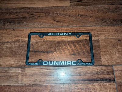 RARE Albany Oregon Nissan Dunmire Jeep Eagle Plastic Dealer License Plate Frame - Image 1 of 2