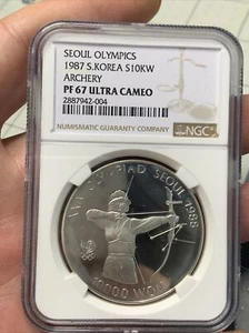 1988 South Korea 10KW Seoul Olympic Games Archery Silver NGC PF67 ULTRA CAMEO - Picture 1 of 2