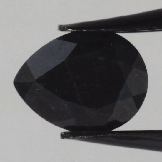 BLACK SAPPHIRE 8 x 6 MM PEAR CUT EARTH MINED AND TREATED F-807 - Image 1 of 1