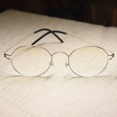 Marco de gafas redondas de titanio para hombre ovalado estilo Steve Jobs gafas doradas Foto 1 de 4