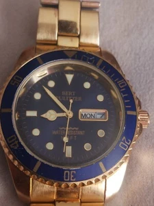 Bert Pulitzer Uhr goldfarben rundes Zifferblatt Tag Datum Anzeige - Bild 1 von 4
