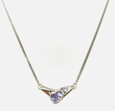 Collar colgante de joyería de tanzanita y platino Foto 1 de 4