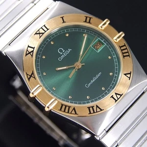 VINTAGE OMEGA CONSTELLATION QUARTZ 18K GOLD BEZEL EMERALD DIAL DATE MEN'S WATCH - Picture 1 of 8